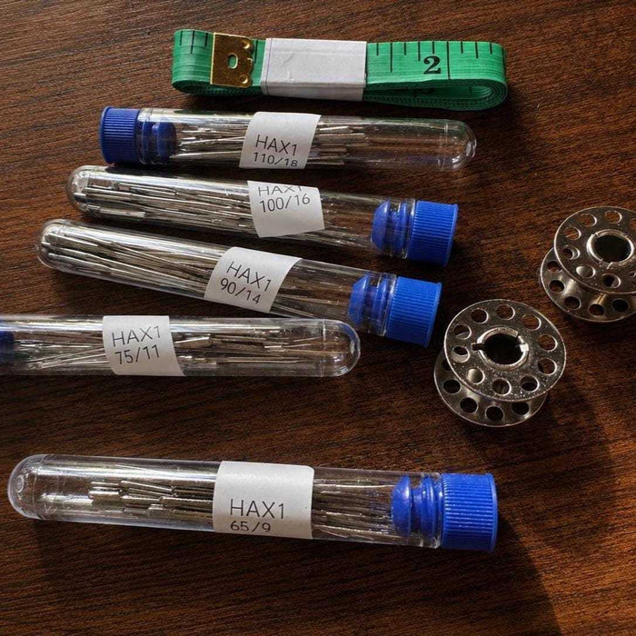 Sewing machine needles with fabric measurement tape for all fabrics